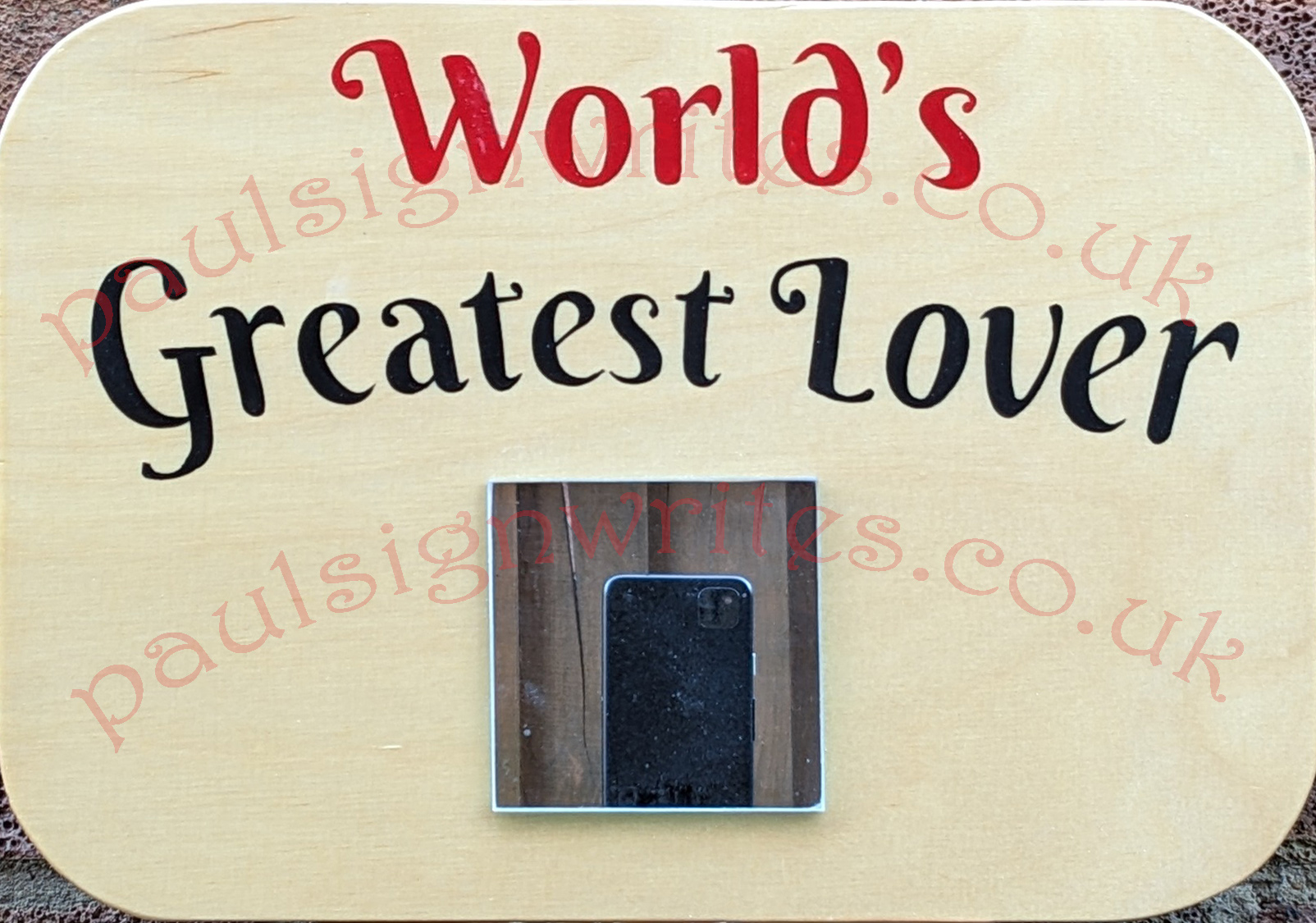The 'World's Greatest Lover' signwritten in red & black, with a 75mm2 mirror to capture their image on a maple panel.