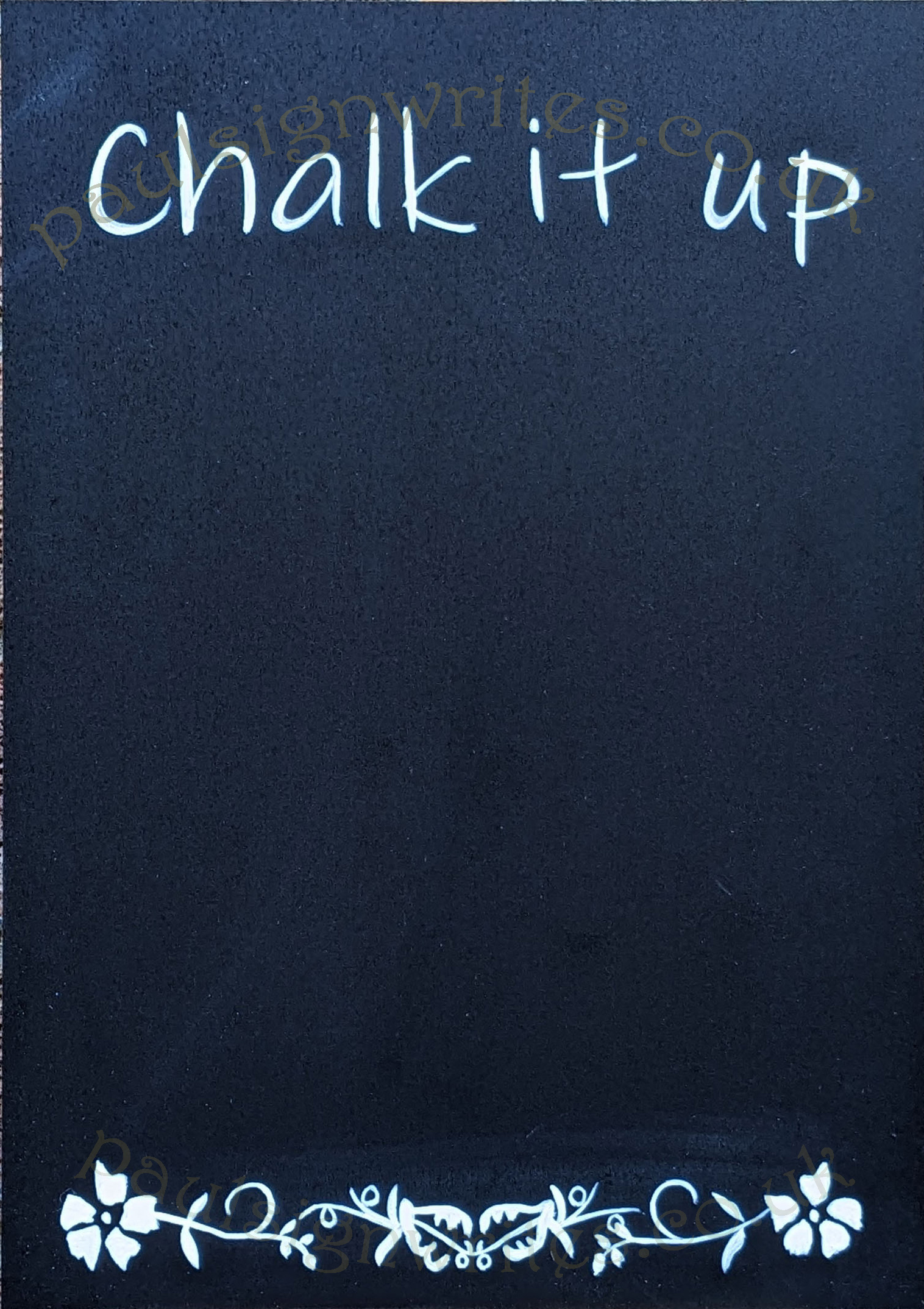 Blackboard with signwritten 'Chalk it up' and decorative motif.